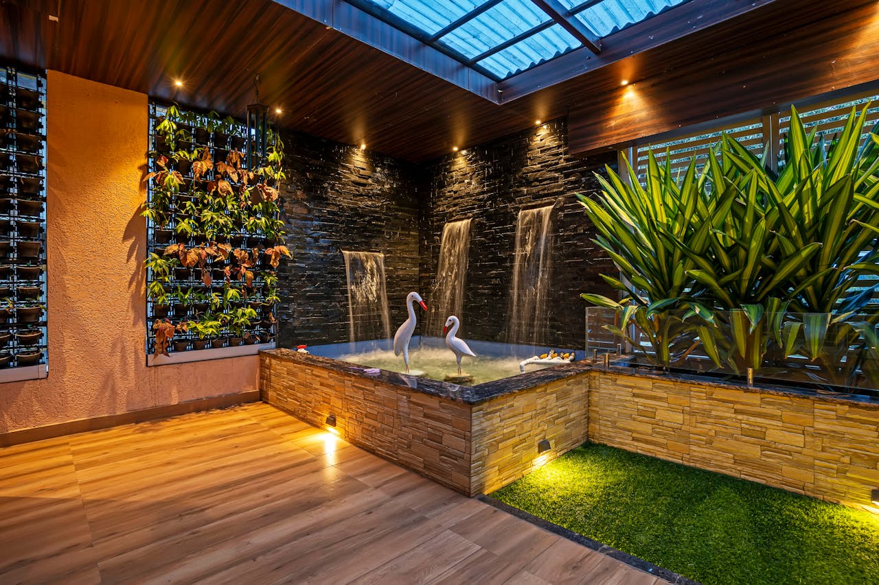 Elegant indoor garden with waterfalls and plants, creating a relaxing oasis in Mumbai, India.